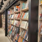 a row of bookshelves filled with lots of books